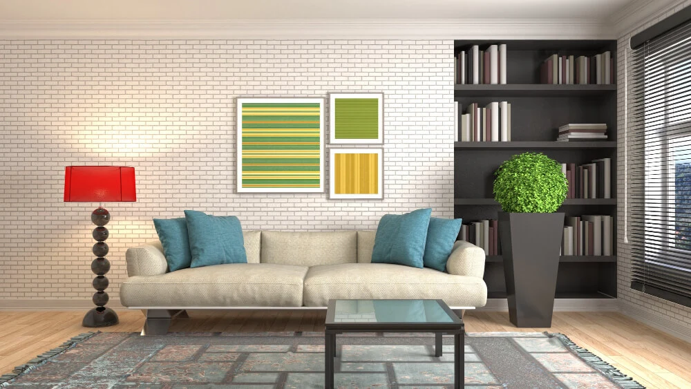 A cozy living room with a beige sofa, teal pillows, a red lamp, and a black bookshelf unit.