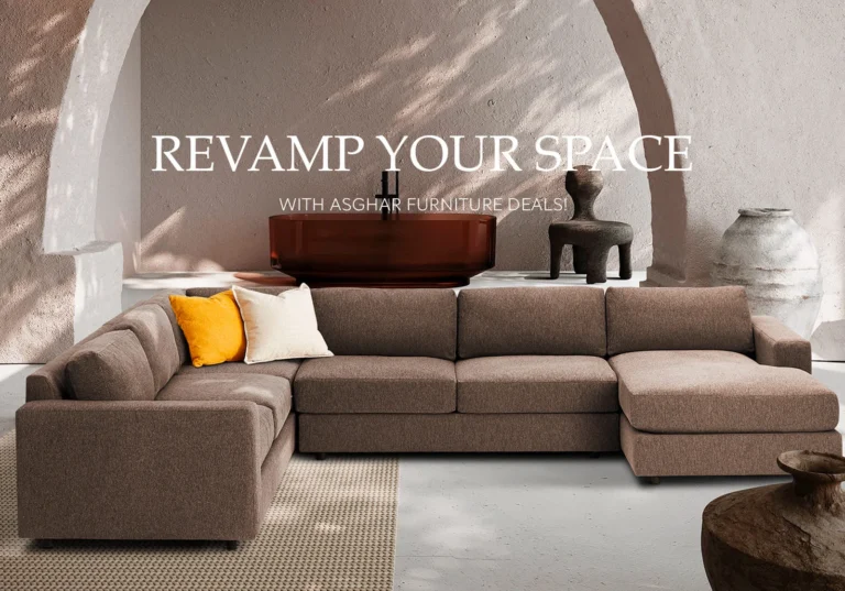 A modern living room with a large brown sectional sofa, orange and white pillows, and the text REVAMP YOUR SPACE WITH ASGHAR FURNITURE DEALS.
