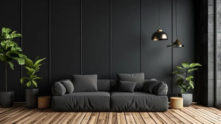A sleek black sofa in a contemporary living room featuring a wooden floor and decorative plants.