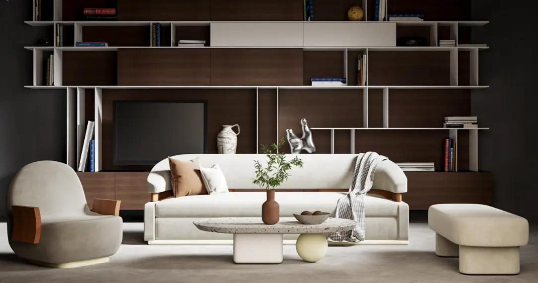 Modern studio apartment furniture with a white sofa, lounge chair, ottoman, coffee table, and built-in wall shelving.